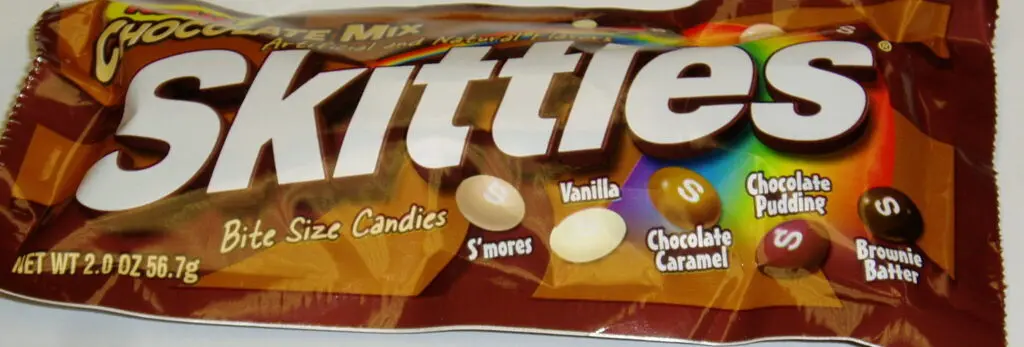A bag of Chocolate Mix Skittles showing flavors including s'mores and chocolate caramel